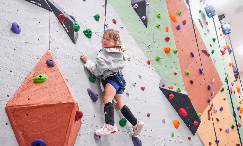 Child rock climbing.